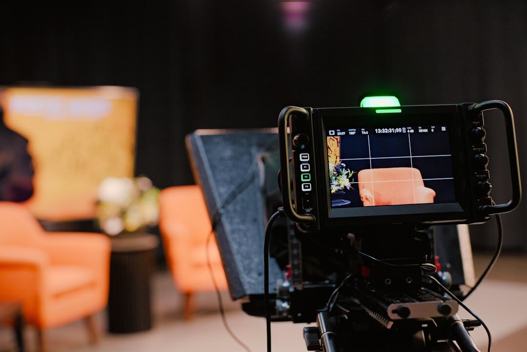 Professional TV news studio setup with multiple screens
