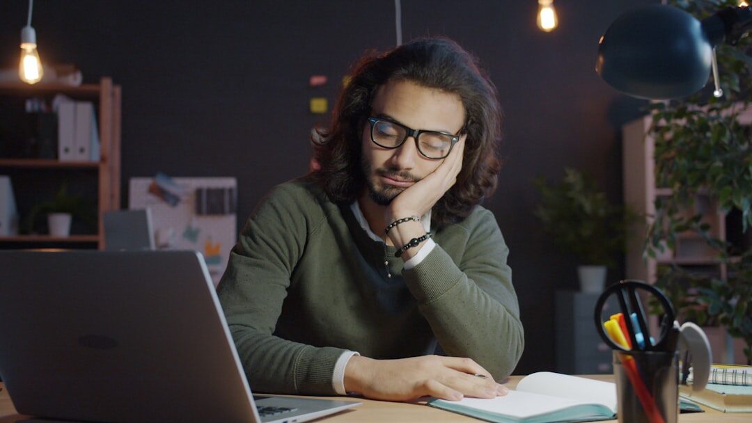 Journalist doing research at a desk with laptop and notes